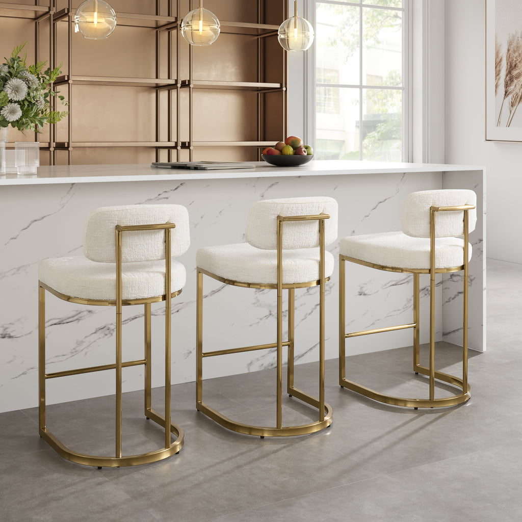 Tabouret de bar Rhea en tissu blanc avec cadre doré