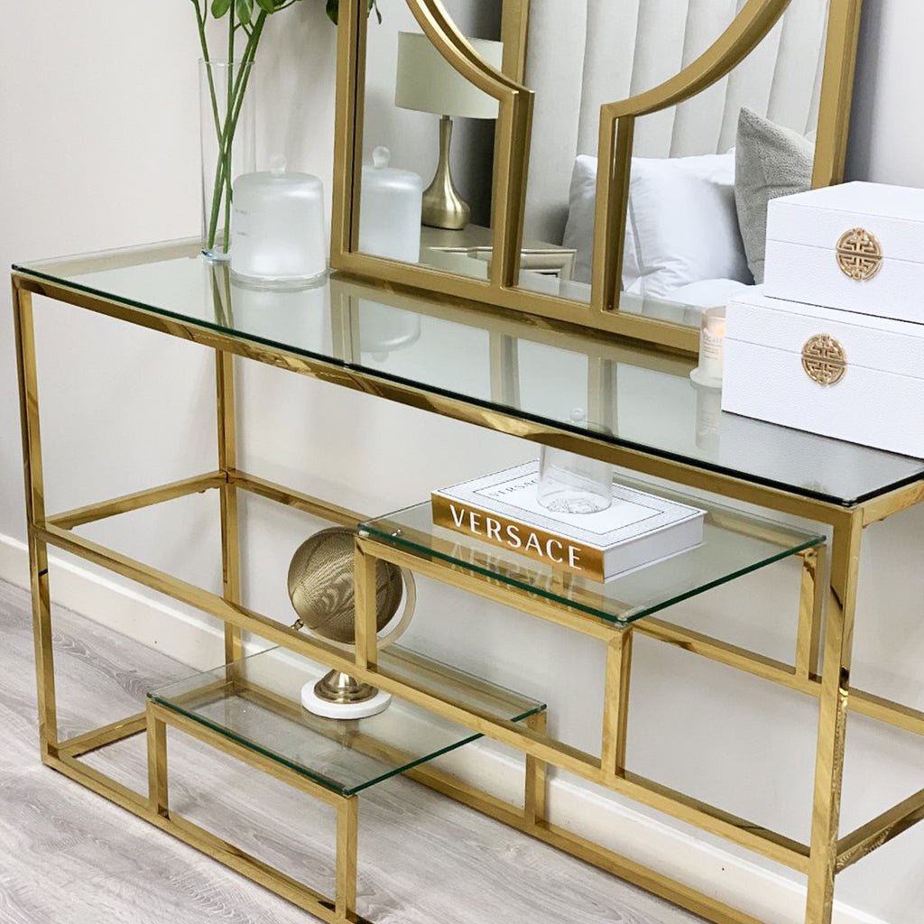 Console Enzo Gold avec plateau en verre transparent et étagères
