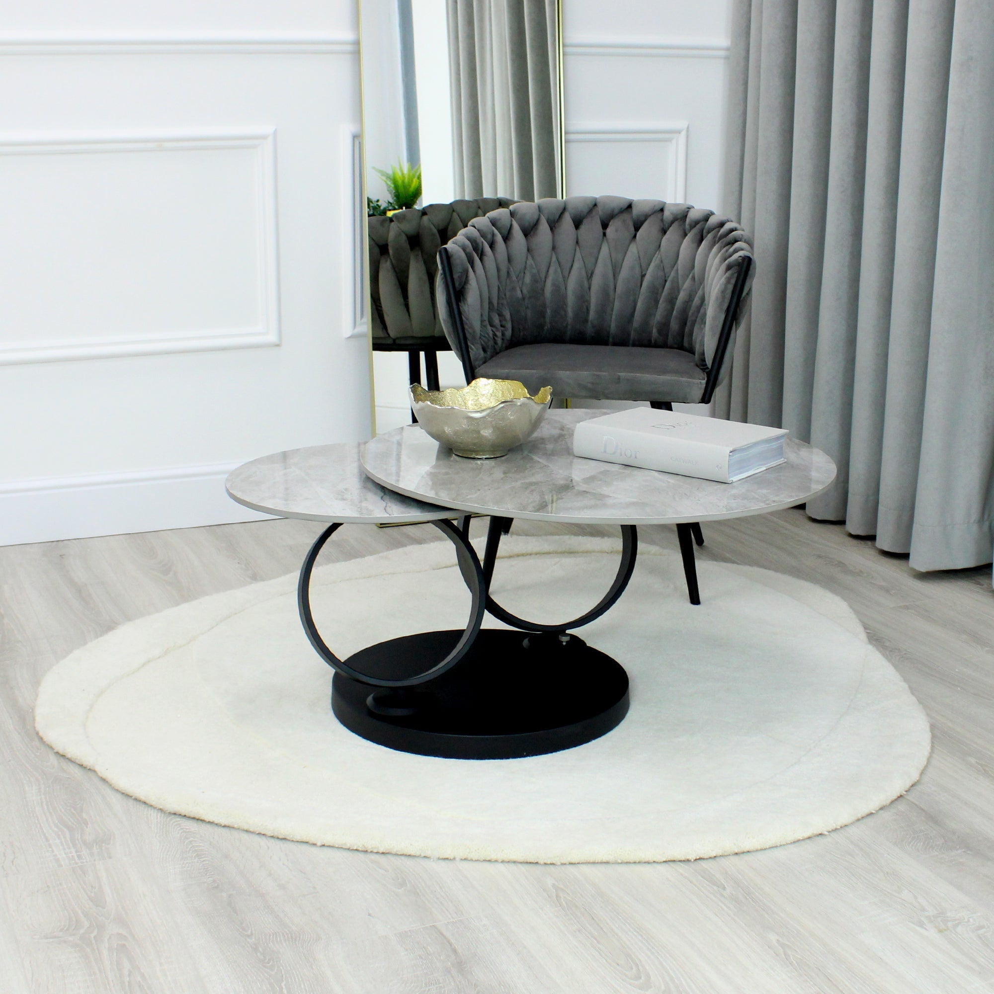 Table basse pivotante en céramique grise effet marbre avec base noire